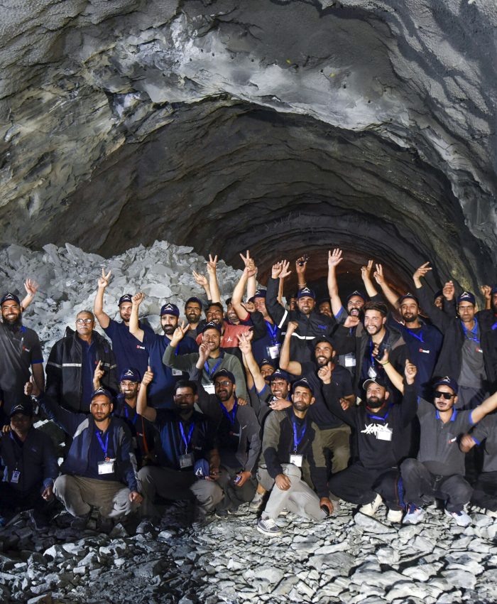 Kargil [Ladakh], Jun 09 (ANI): Workers show a victory sign after Union Road Transport and Highways Minister Nitin Gadkari, Jammu and Kashmir Chief Minister Omar Abdullah, and state Lieutenant Governor Manoj Sinha grace the final 'breakthrough' ceremony of the world's longest single-tube bidirectional Zojila Tunnel, at Minamarg, in Kargil on Tuesday. (ANI Photo)